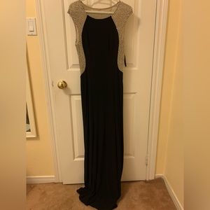Black floor length gown with mesh and beaded detailing
